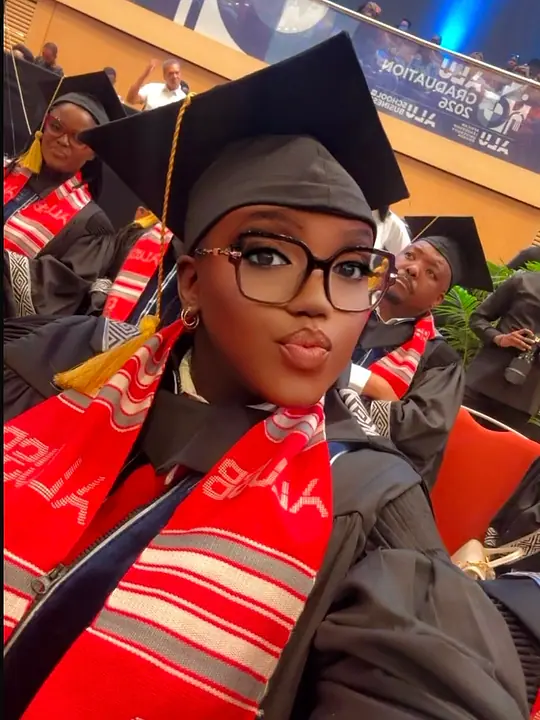 Nyampinga Laetitia taking a candid portrait in her graduation cap, gown and ALUSB stole
